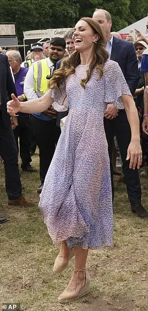 Kate plays football during a visit to Cambridgeshire in 2022