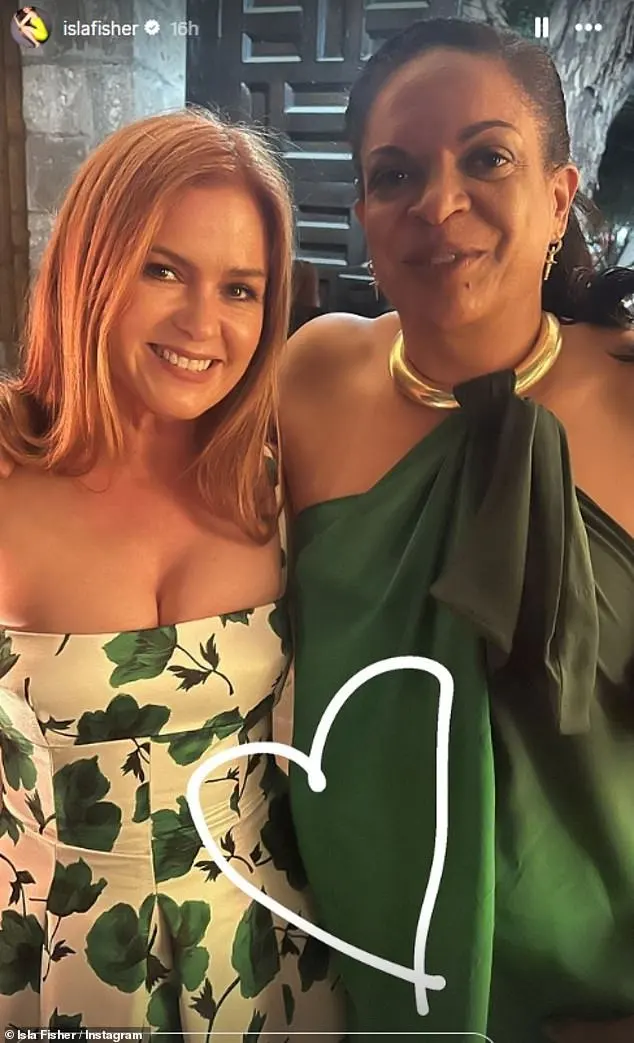 Newly-single Isla Fisher was one of the celebrity guests in attendance and shared a series of snaps at the wedding (pictured with a friend)