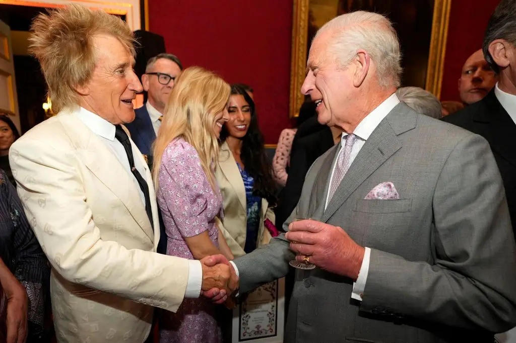 Rod Stewart shaking the King's hand