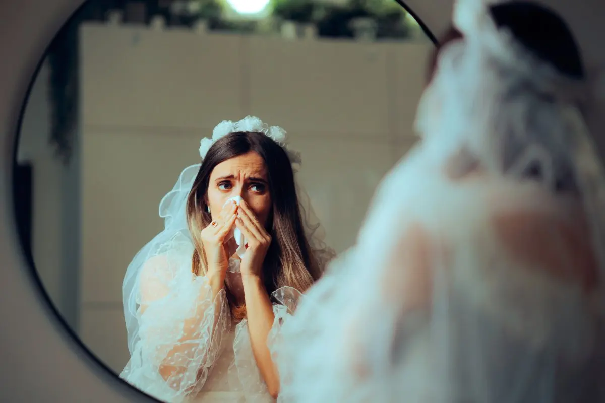 A woman looks upset in wedding dress