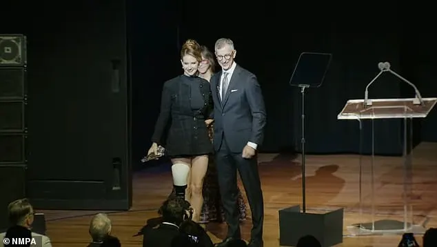 Once safely inside the venue, Lana joined NMPA president David Israelite and her publicist Jody Gerson onstage to accept the trophy for NMPA Songwriter Icon 2024