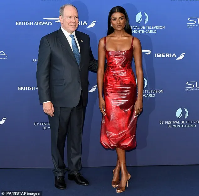 Prince Albert, the eldest son of the late Grace Kelly, wore a black suit with a white shirt and a patterned blue tie