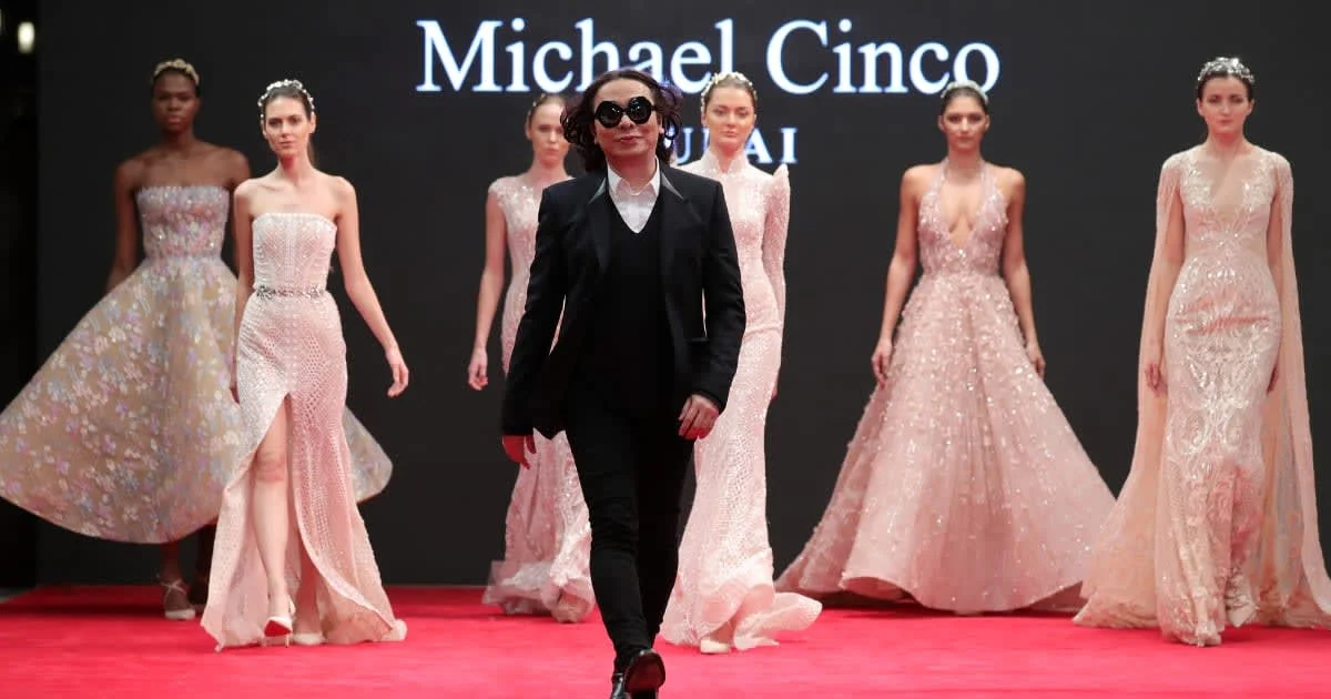 Representative Image Source: Fashion designer Michael Cinco with models walk the red carpet after his show during D3 Presents: DIFF Fashion Forward on day seven of the 13th annual Dubai International Film Festival held at the Madinat Jumeriah Complex on December 13, 2016 in Dubai, United Arab Emirates. (Photo by Neilson Barnard/Getty Images for DIFF)