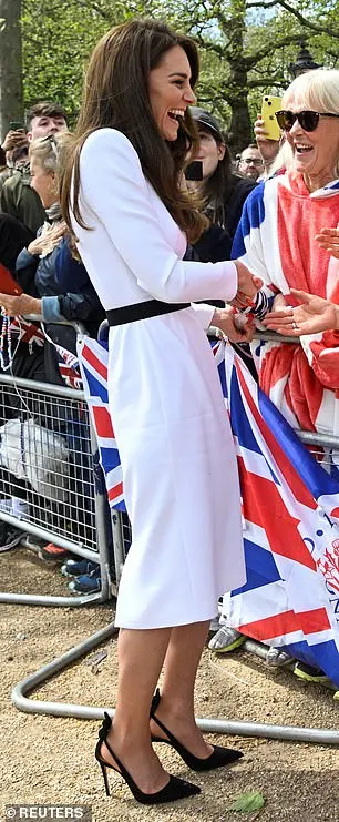 Kate meets well-wishers during a walkabout on the Mall outside Buckingham Palace ahead of the coronation