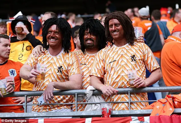 A group of Holland supporters have come under criticism for doing 'blackface'