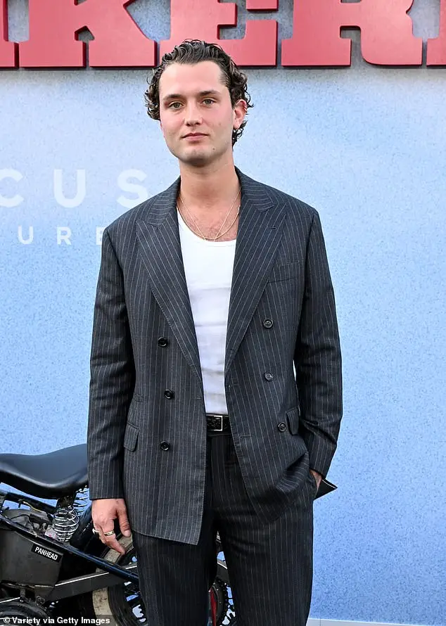 Rafferty Law - the son of actor Jude Law - also made an appearance at the event in a dark gray, pin-striped suit and added a plain, white shirt underneath