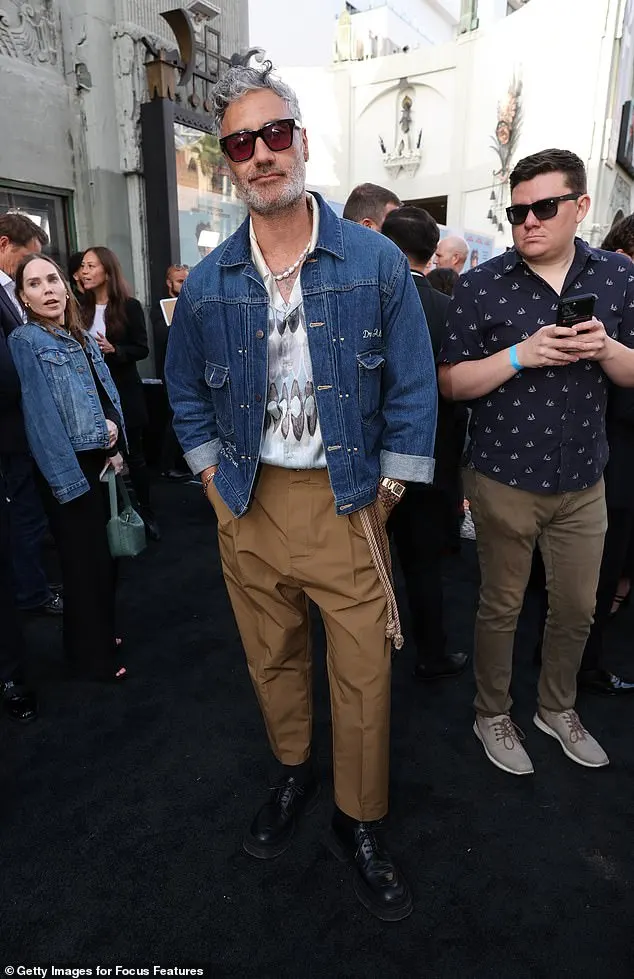 The director, 48, rocked a denim jacket and brown cargo trousers for the premiere