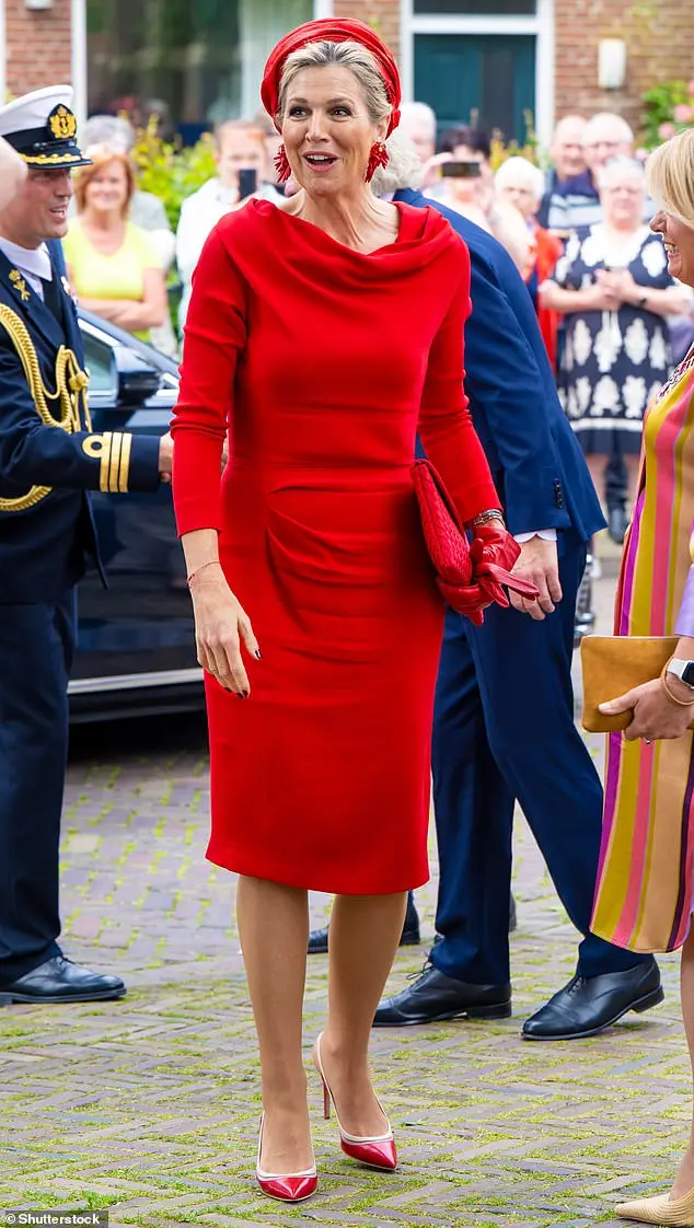 The Dutch royal being greeted as she steps out the car. Last week, on a four-day trip to the US, the queen donned a similar elegant shade of ruby red