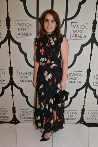 Princess Eugenie of York wearing a black floral maxi dress and black pumps at the FTA dinner in celebration in London June 2024