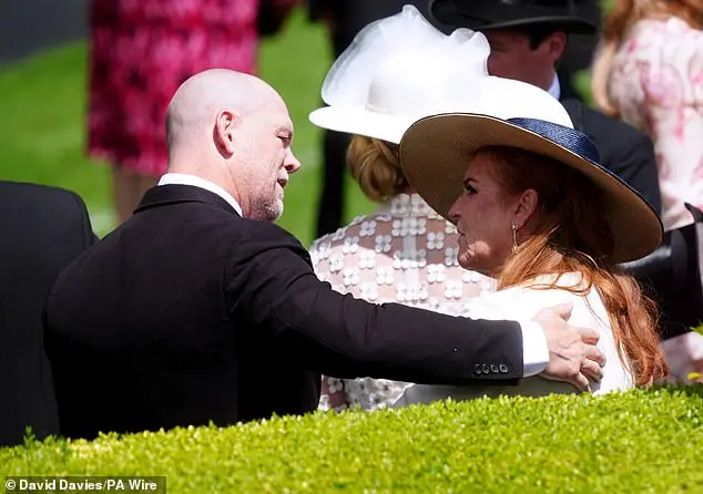 Mike Tindall put an arm around the Duchess of York in the royal enclosure