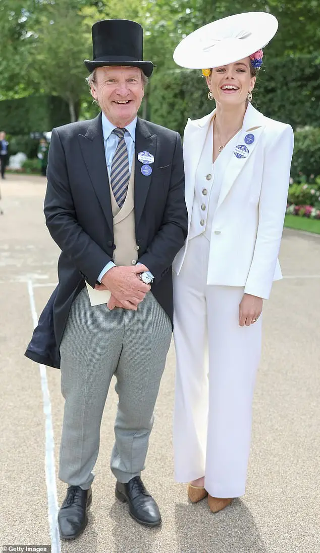 Sports broadcaster Rupert Bell (pictured left) posed for a photograph next to model Rosie Tapner (pictured right)