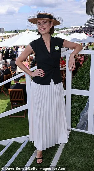 Kara Tointon looked elegant in a black vest top which she paired with a white pleated skirt