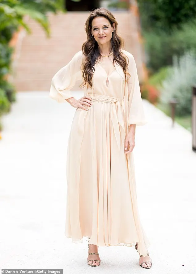 Katie Holmes looked stylish in a cream ruffled maxi dress as she attended the photocall for the Filming Italy Festival 2024 on Friday