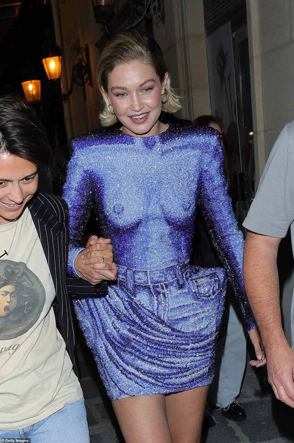 Mother-of-one Gigi swapped her runway ensemble for a sexy afterparty look as she strutted to the celebrity-filled bash to let loose