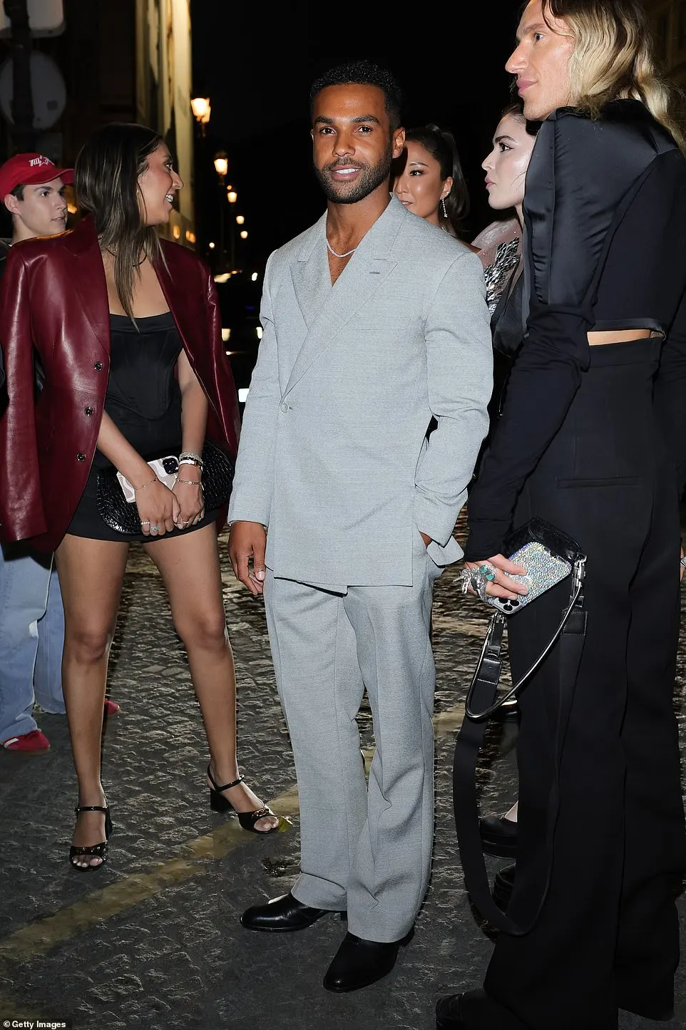 Emily In Paris actor Lucien Laviscount looked dashing in a trendy grey suit as he arrived at the star-studded afterparty