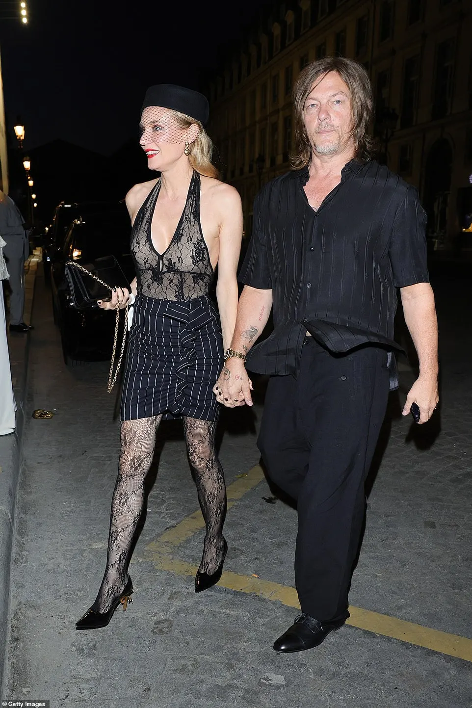 Diane Kruger and husband Norman Reedus held hands in their smart attires as they arrived at the afterparty