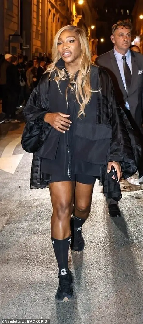 Serena Wiliams opted for a black mini dress and a matching jacket and added a casual touch with a pair of black trainers