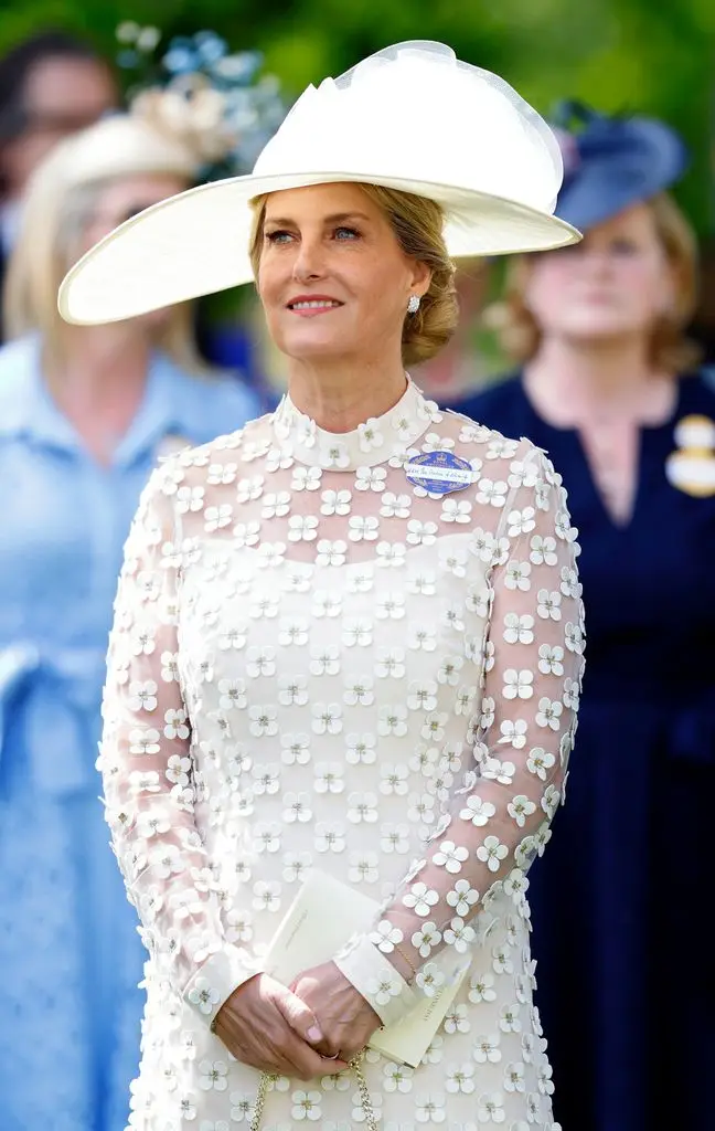 Sophie in white dress and hat