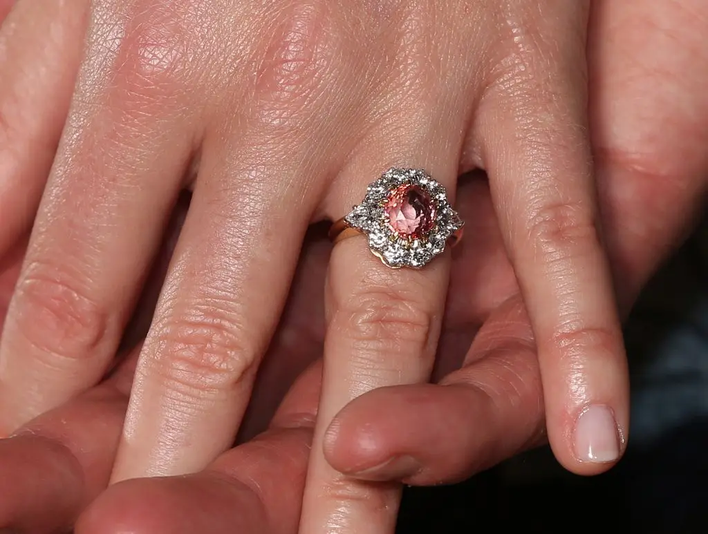 A close-up of Princess Eugenie's padparadscha sapphire engagement ring