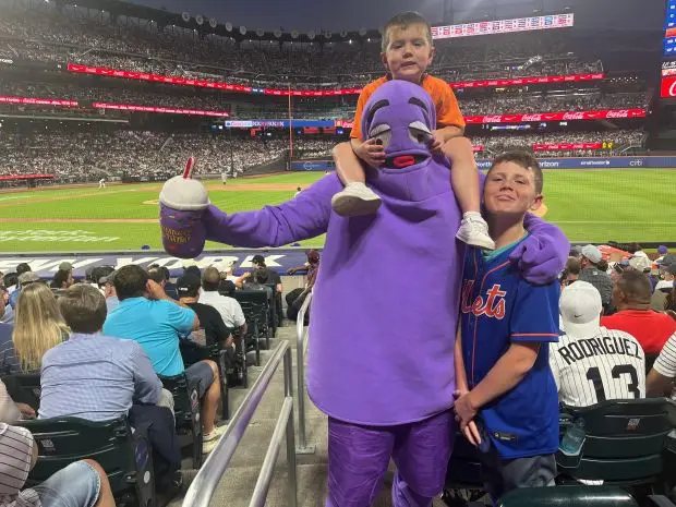 Tommy McDougall, 41, of Bethpage with two of his children. ( Photo by Peter Sblendorio )