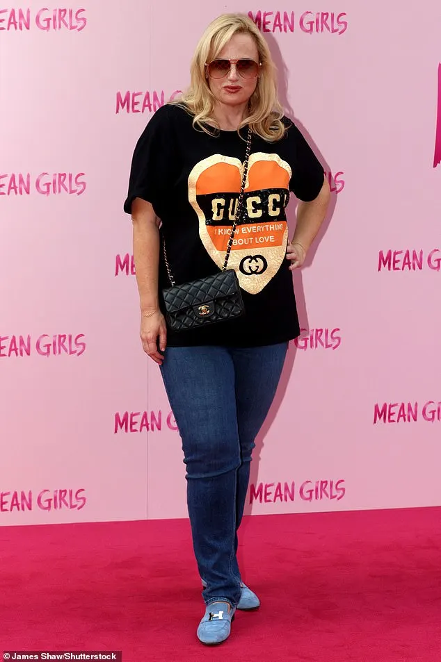 Rebel Wilson decided to ignore Mean Girls' iconic pink dress code as she arrived for the press night of the West End musical on Tuesday