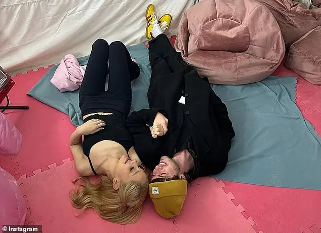 The pop star's bestie, Doug Middlebrook, posted a shot showing the duo wearing all black as they lie down and laugh