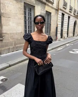 Woman in black summer dress