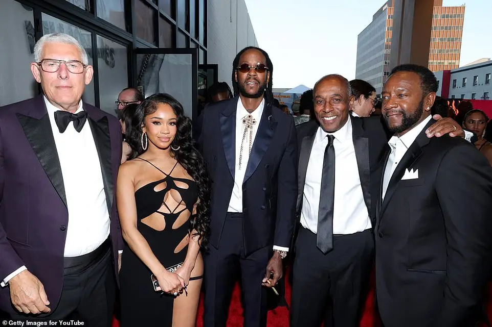 The talented twosome also posed with Google & YouTube's global head of music Lyor Cohen (L), UMG general counsel and EVP Jeffrey Harleston (2-R), and iHeartMedia staffer Doc Wynter (R)