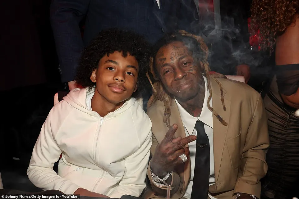 Five-time Grammy winner Lil Wayne (R) brought along his 14-year-old son Kameron Carter (L, with babymama #3 Lauren London) to the YouTube Music Leaders and Legends Event