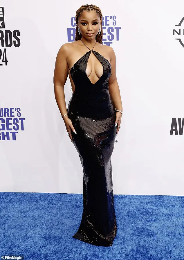 Halle Bailey's sister, Chloe Bailey, also stunned on the red carpet in a black, sequin gown that clung to her frame and had a cutout around the bodice for a sultry flare