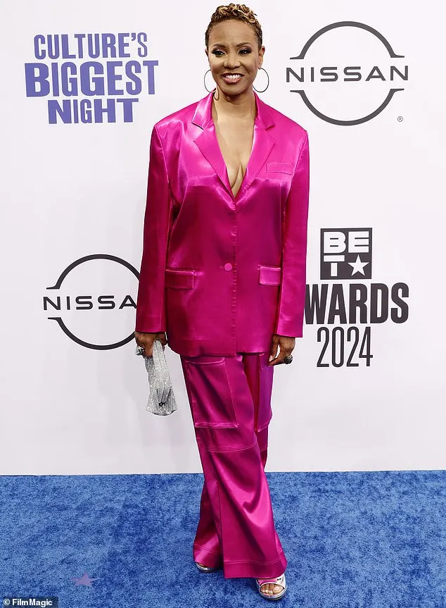 MC Lyte stunned in a hot pink, satin blazer that was buttoned at the front, as well as a pair of matching trousers