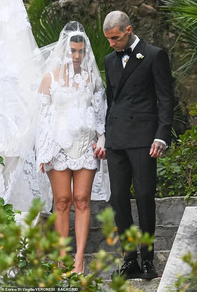 Kourtney Kardashian turned heads in her sizzling Dolce & Gabbana satin corset mini wedding dress as she tied the knot to Travis Barker in Portofino, Italy, in May 2022. Rochelle said Kourtney's dress 'suited the look she was going for'