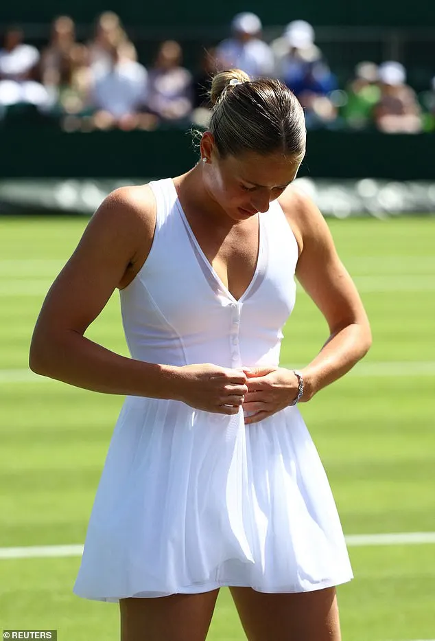 Marta was snapped preparing to jump into an action-filled match by unbuttoning her sheer white overlay, revealing a stunning dress designed by Wilson