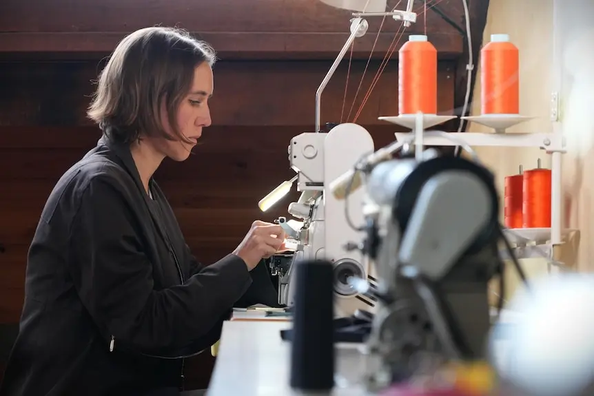 Luka Rey using a sewing machine.