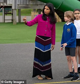 In June, Ms Murty continued her low-key dressing by rewearing a £225 striped midi dress from Jigsaw while touring Shinewater Primary School in Eastbourne