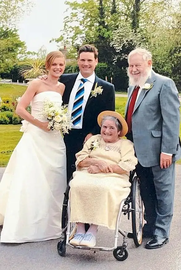 The couple pictured on their wedding day in Essex with Keir's parents Jo, who suffered from Still's Disease, and Rod