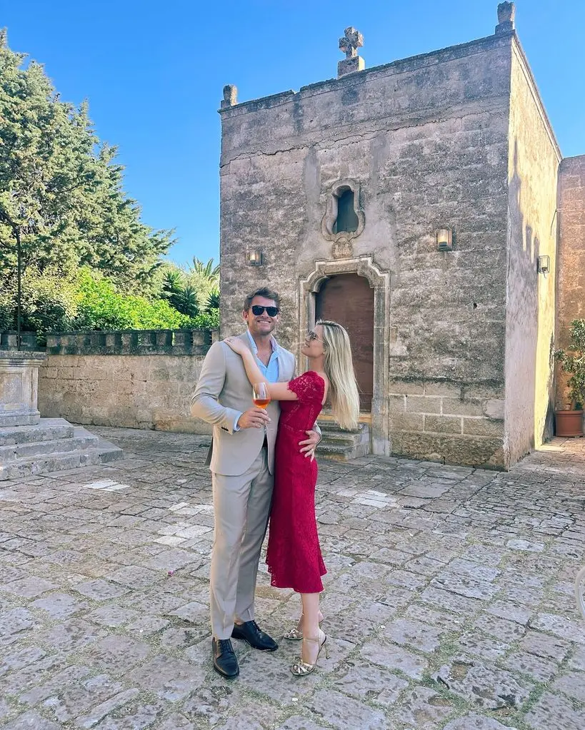 Lady Amelia Spencer hugging husband Greg Mallett at wedding in Italy