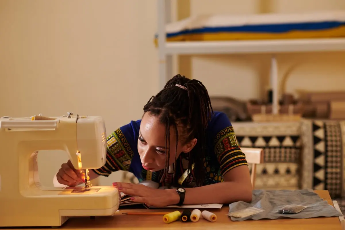 Stock image of woman sewing.