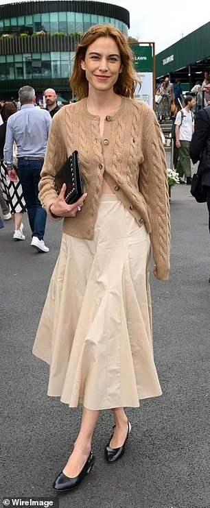 Alexa Chung showed off her impeccable style in a brown knitted cardigan and midi skirt