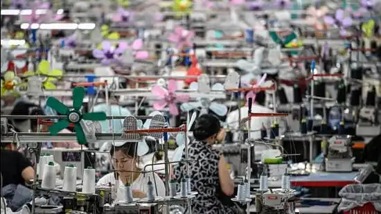 This photo taken on June 11, 2024 shows workers producing garments at a textile factory that supplies clothes to fast fashion e-commerce company Shein in Guangzhou in southern China's Guangdong province. (Photo by Jade GAO / AFP) (AFP)