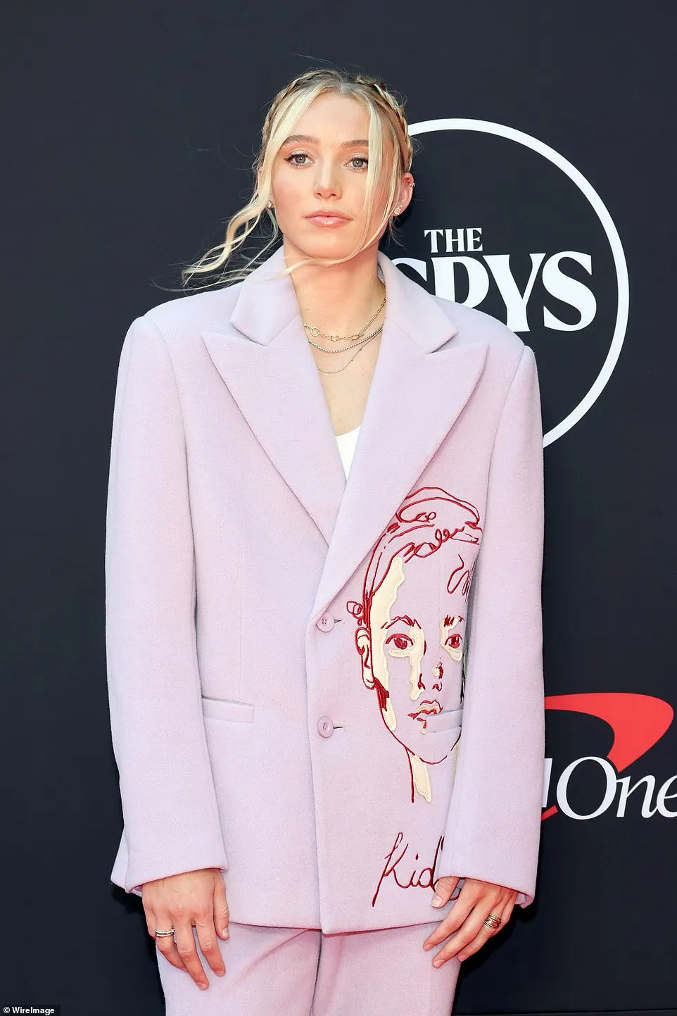 UConn star Paige Bueckers looked cool in an oversize KidSuper mauve suit made of a thick material, but the brand's recognizable doodle on the front added little