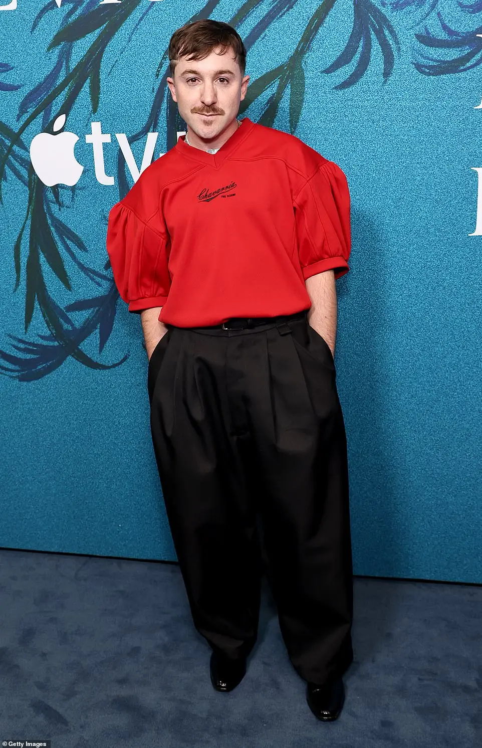 Production designer JC Molina made a fashion statement in a red jersey, which was tucked into his pleated, wide-leg black trousers