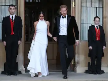 Prince Harry, Duke of Sussex, (R) and Meghan Markle, Duchess of Sussex, (L) leave Windsor Castle on their wedding day