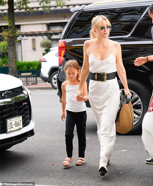 She complemented the stylish ensemble with a pair of dark aviators