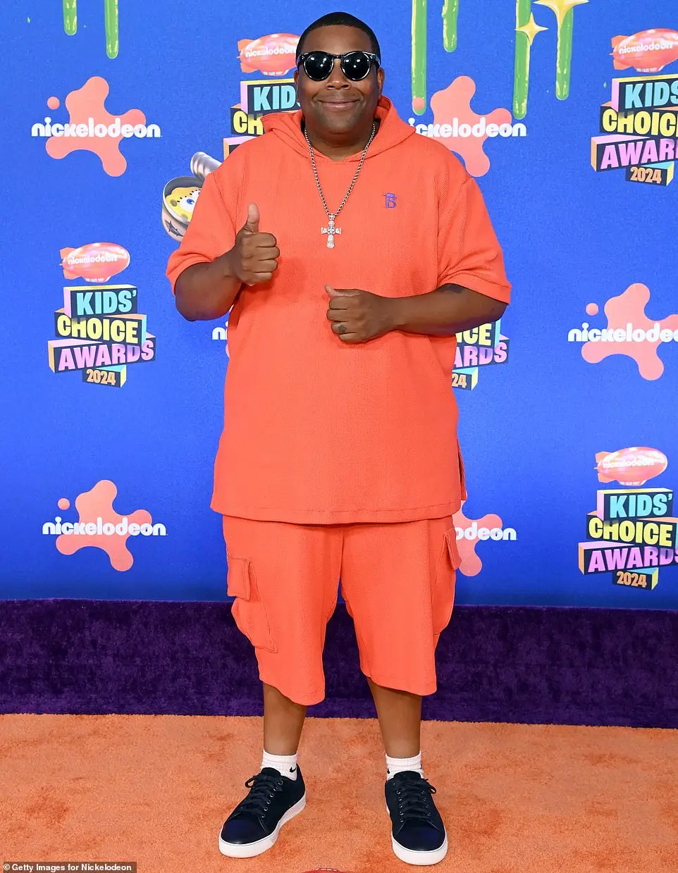 Kenan Thompson turned heads in an eye-catching ensemble wearing a short-sleeved, vibrant orange hoodie as well as matching shorts