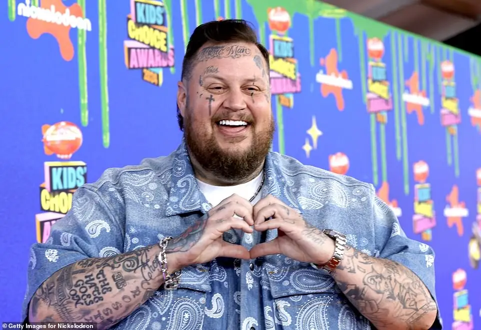 Jelly Roll was also seen making a heart sign with his hands as he walked along the red carpet