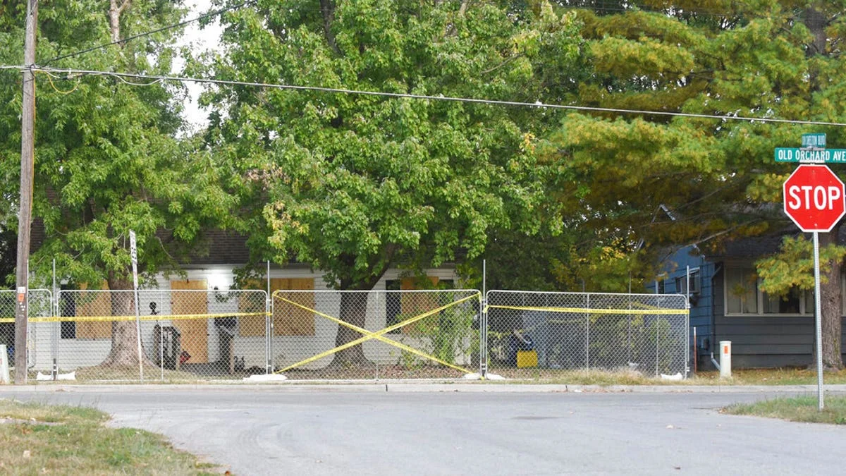 Timothy Haslett's small home boarded up and taped off