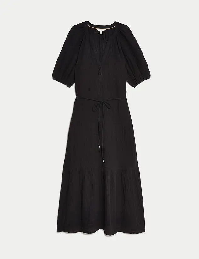 Marks and Spencer’s easy textured black tiered dress (£45) has a softly cinched tie waist