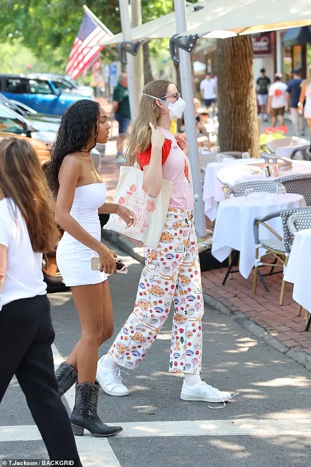 Ben Affleck 's daughter wore a red and pink shirt, patterned white pants and sneakers. She also sported her signature frames and a face mask