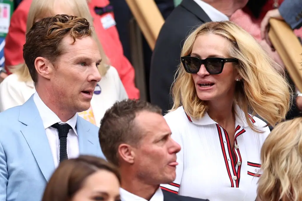 Benedict Cumberbatch and Julia Roberts talk in the Royal Box ahead of the Gentlemen's Singles Final between Novak Djokovic of Serbia and Carlos Alcaraz of Spain during day fourteen of The Championships Wimbledon 2024 at All England Lawn Tennis and Croquet Club on July 14, 2024 in London, England.